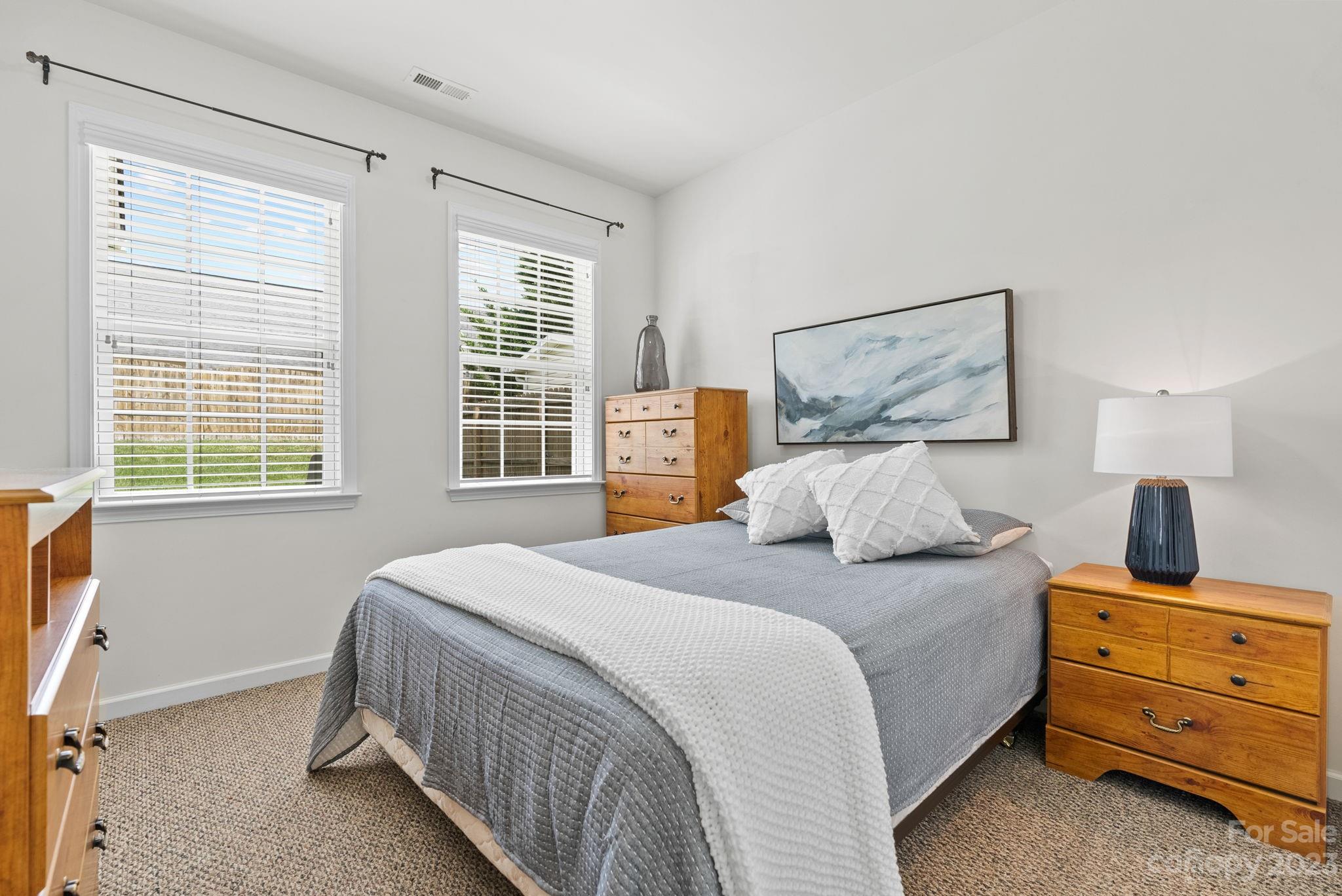 60 West Hiawassee Road Fletcher, NC 28732 - Photo 25 of 40 a bedroom with a bed and wooden floor