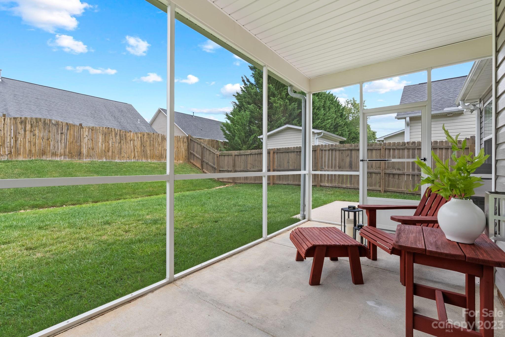 60 West Hiawassee Road Fletcher, NC 28732 - Photo 30 of 40 a house view with a garden space and outdoor seating