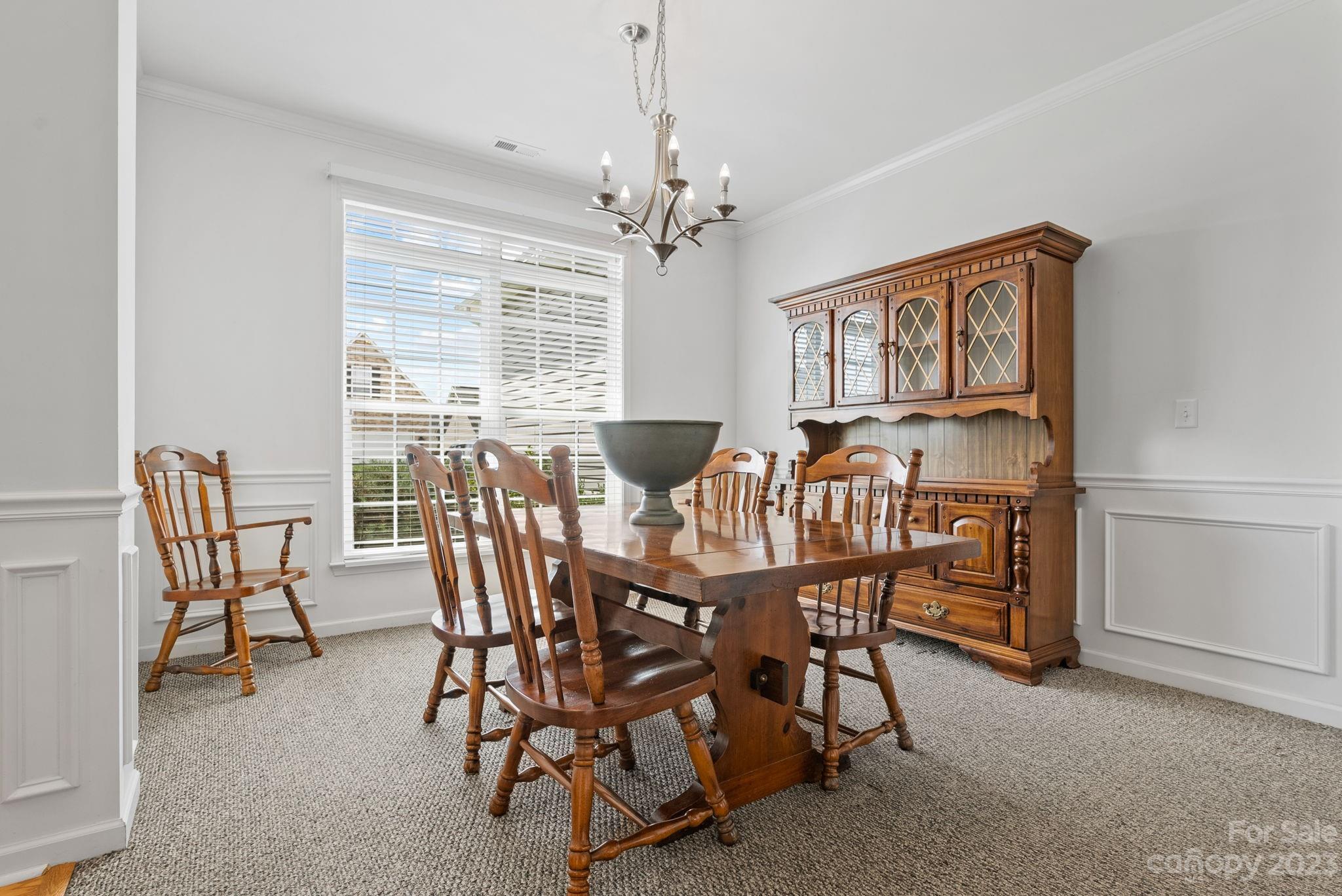 60 West Hiawassee Road Fletcher, NC 28732 - Photo 3 of 40 a dining room with furniture a chandelier and window