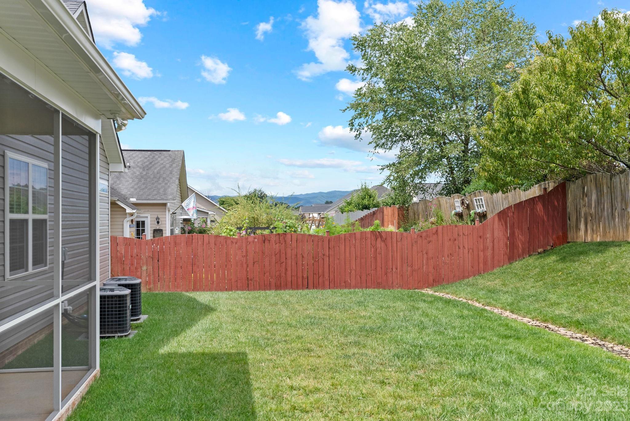 60 West Hiawassee Road Fletcher, NC 28732 - Photo 33 of 40 a backyard of a house with lots of green space