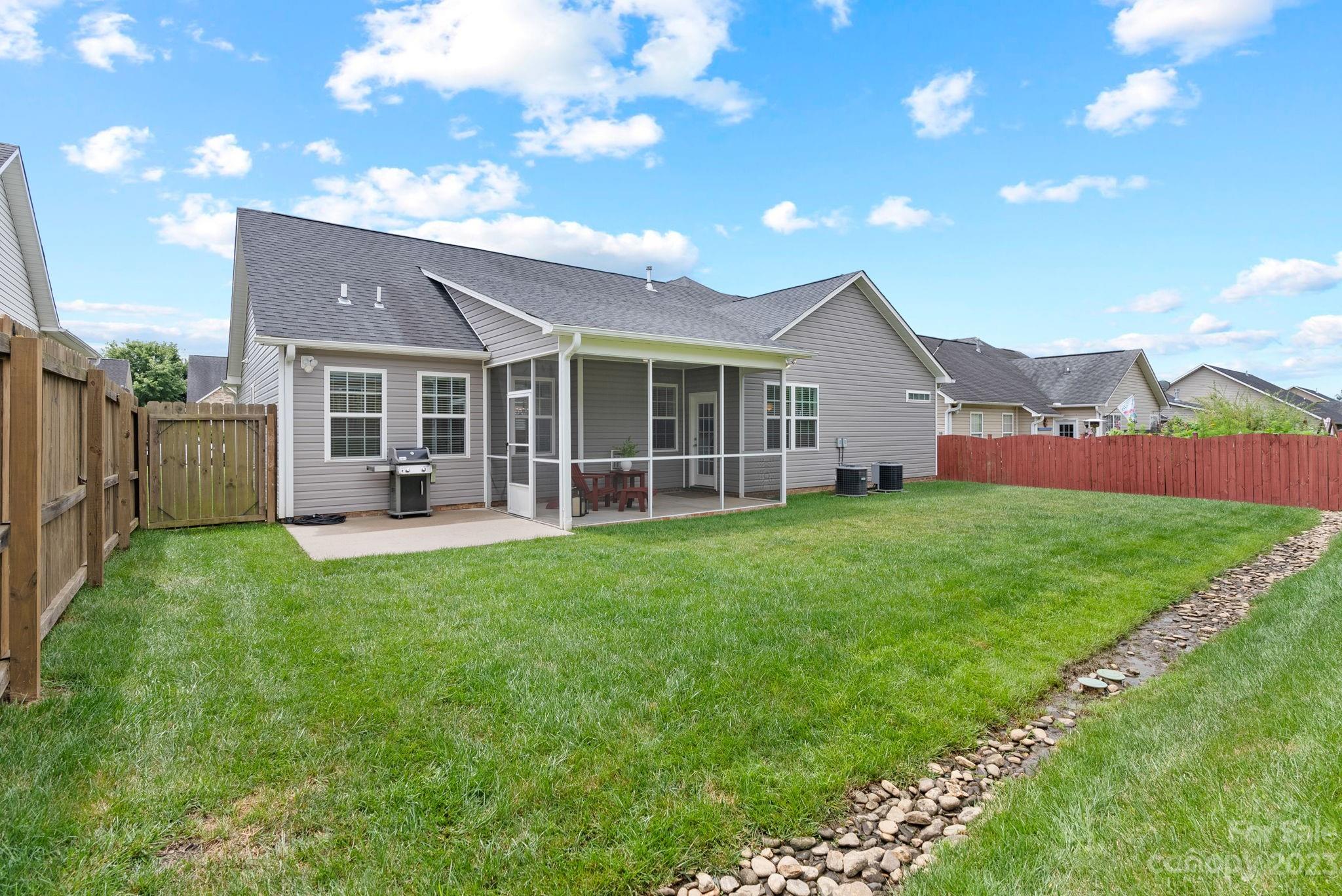 60 West Hiawassee Road Fletcher, NC 28732 - Photo 34 of 40 a view of an house with backyard space and garden
