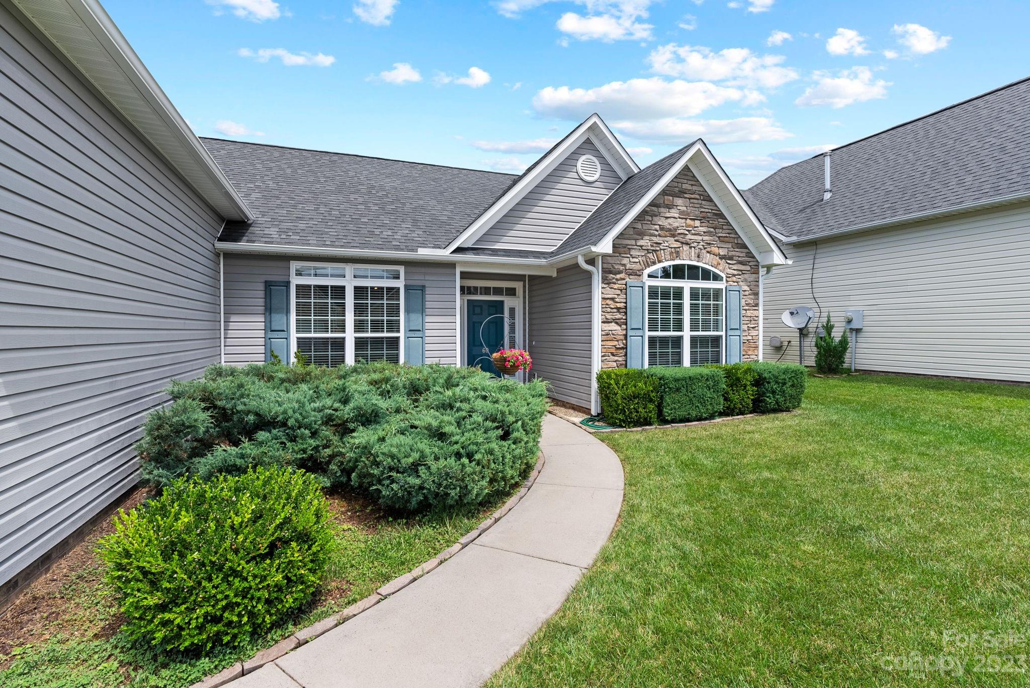 60 West Hiawassee Road Fletcher, NC 28732 - Photo 35 of 40 a front view of a house with a yard