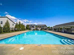 60 West Hiawassee Road Fletcher, NC 28732 - Photo 37 of 40 a view of a swimming pool with an outdoor seating and a garden