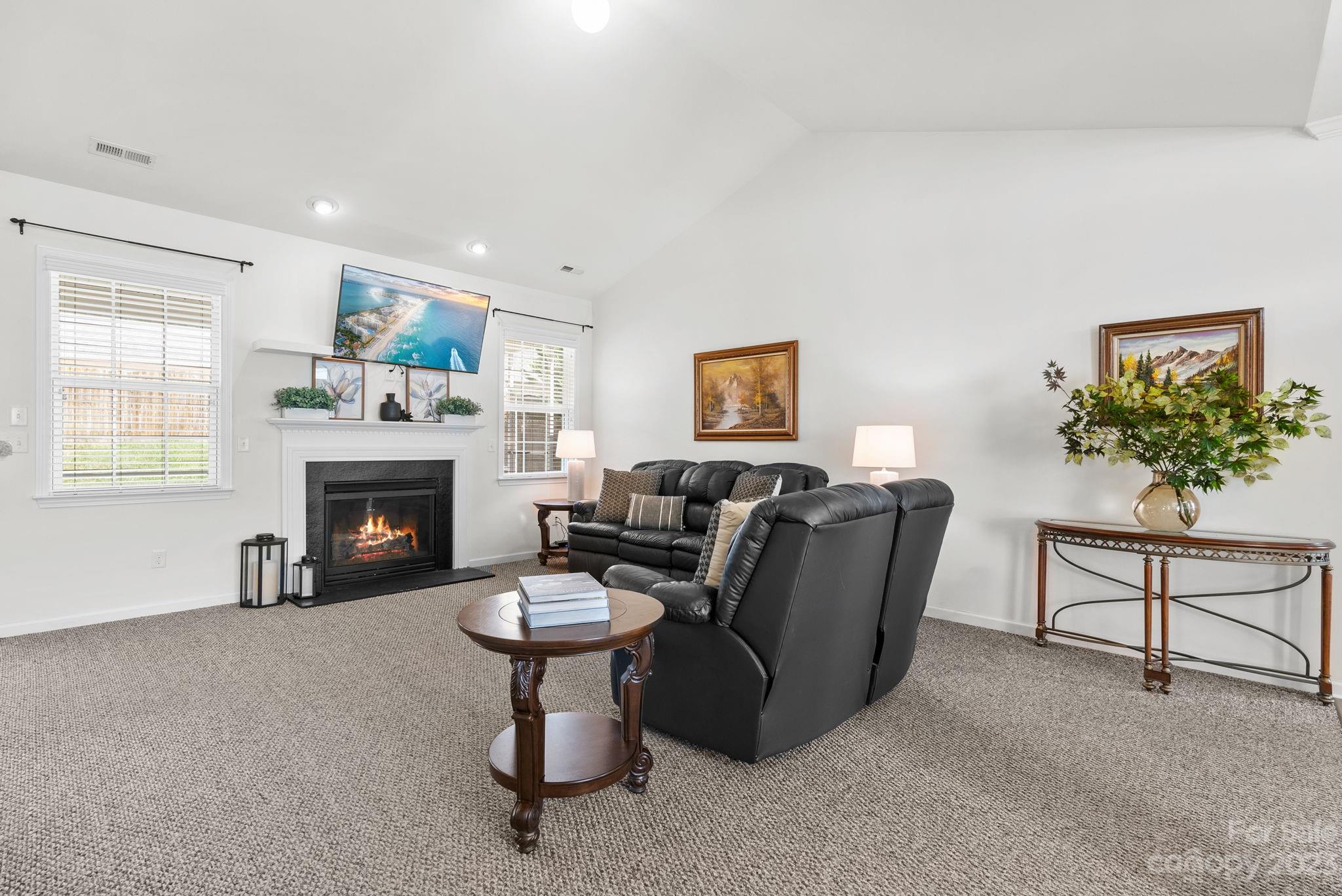 60 West Hiawassee Road Fletcher, NC 28732 - Photo 4 of 40 a living room with furniture a fireplace and a window