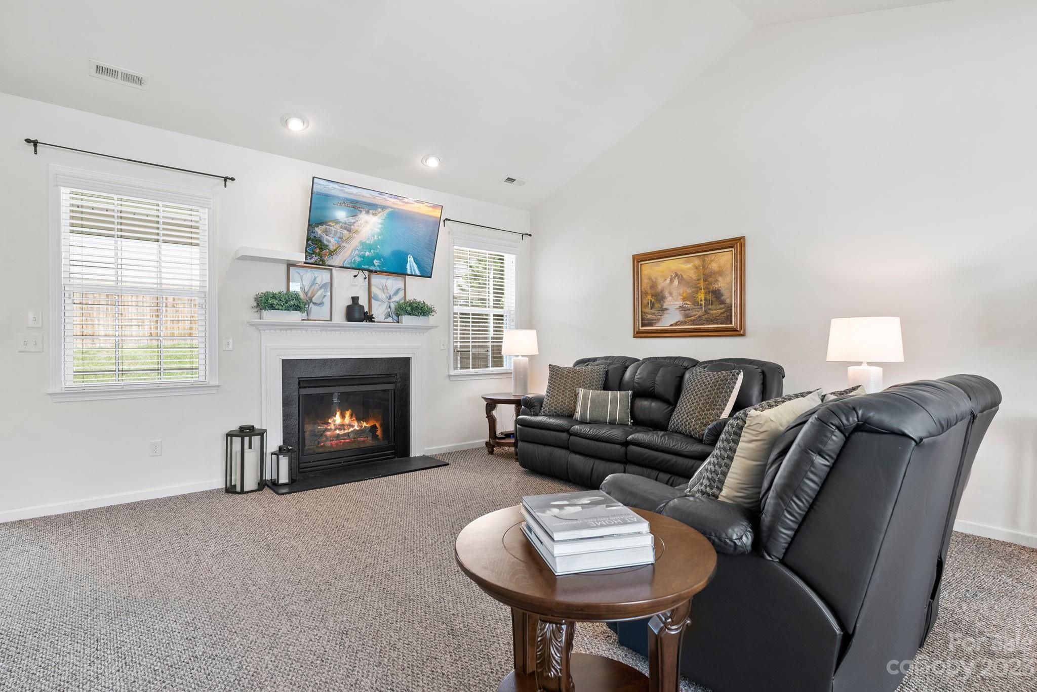 60 West Hiawassee Road Fletcher, NC 28732 - Photo 8 of 40 a living room with furniture and a fireplace