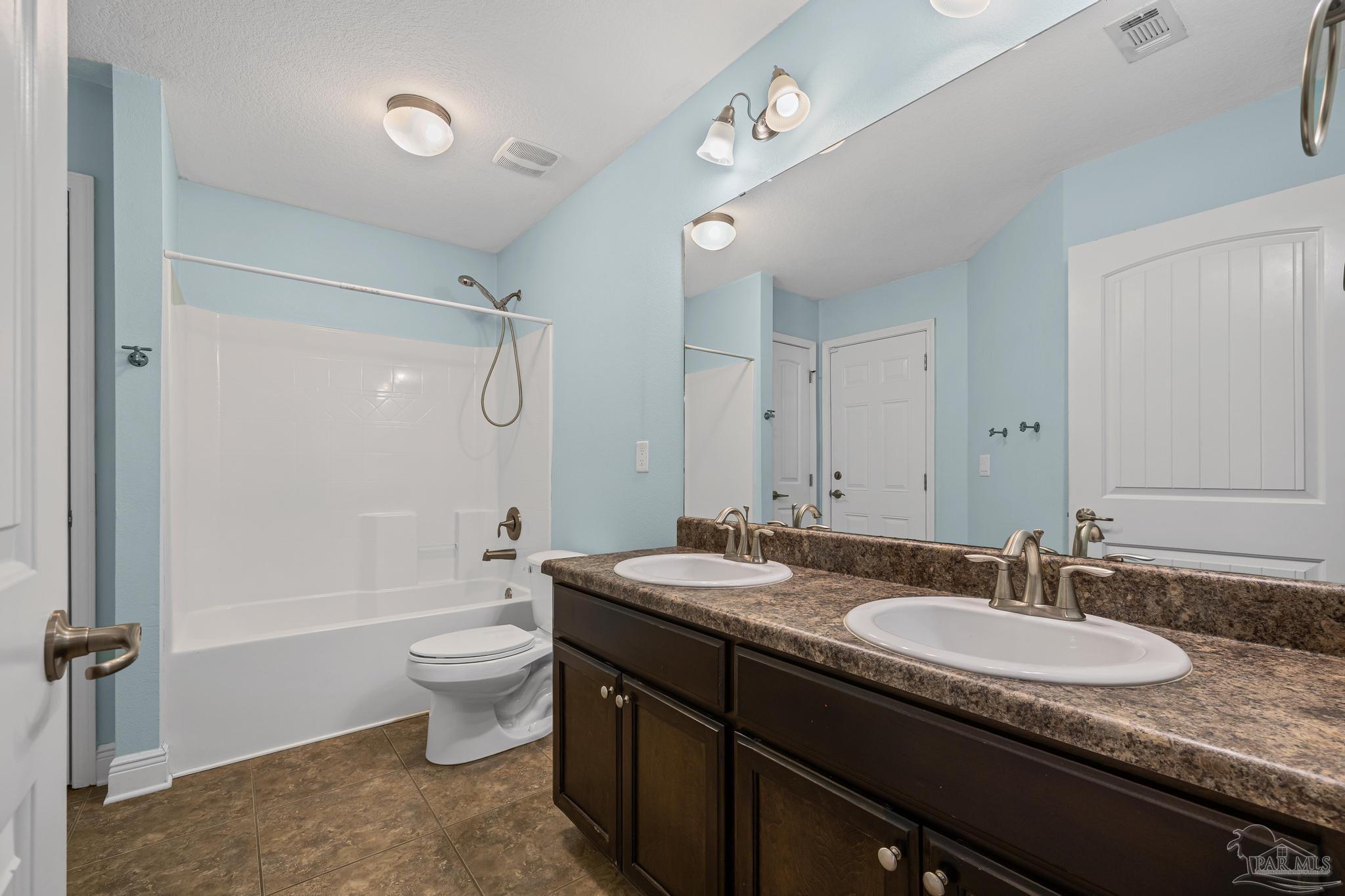 4479 Fort Sumter Road Milton, FL 32583 - Photo 22 of 34 double vanities; door to porch; between BR 2 & 3