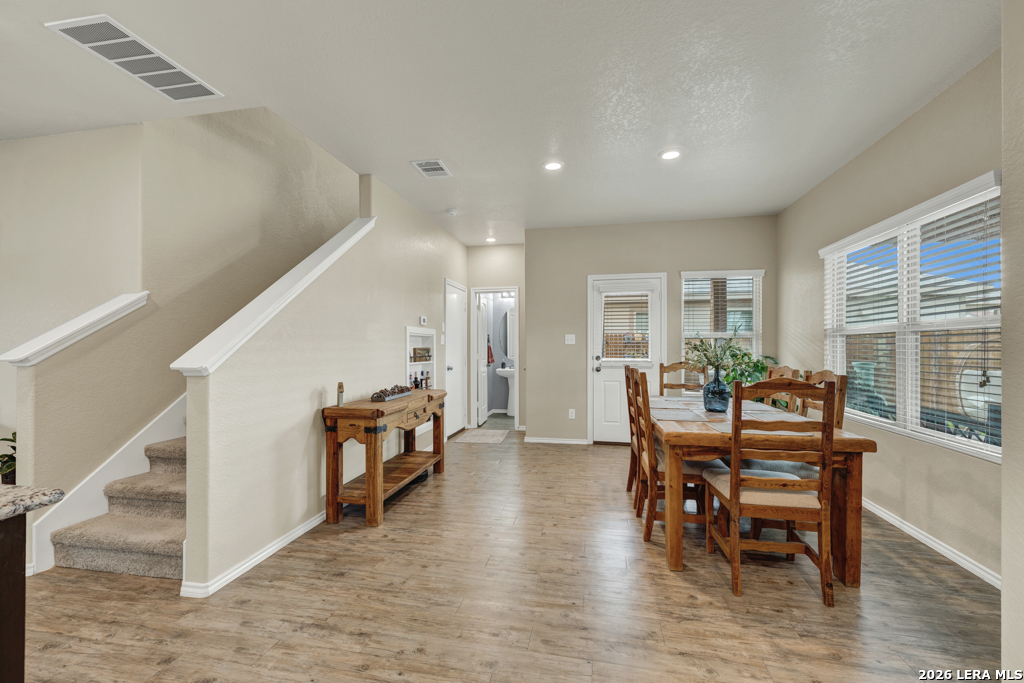124 Field Ridge New Braunfels, TX 78130 - Photo 12 of 43 a dining room with furniture and wooden floor