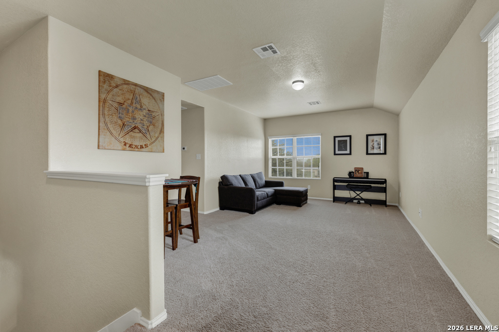 124 Field Ridge New Braunfels, TX 78130 - Photo 17 of 43 a living room with furniture and a gym