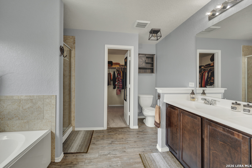 124 Field Ridge New Braunfels, TX 78130 - Photo 22 of 43 a bathroom with a sink a toilet and shower