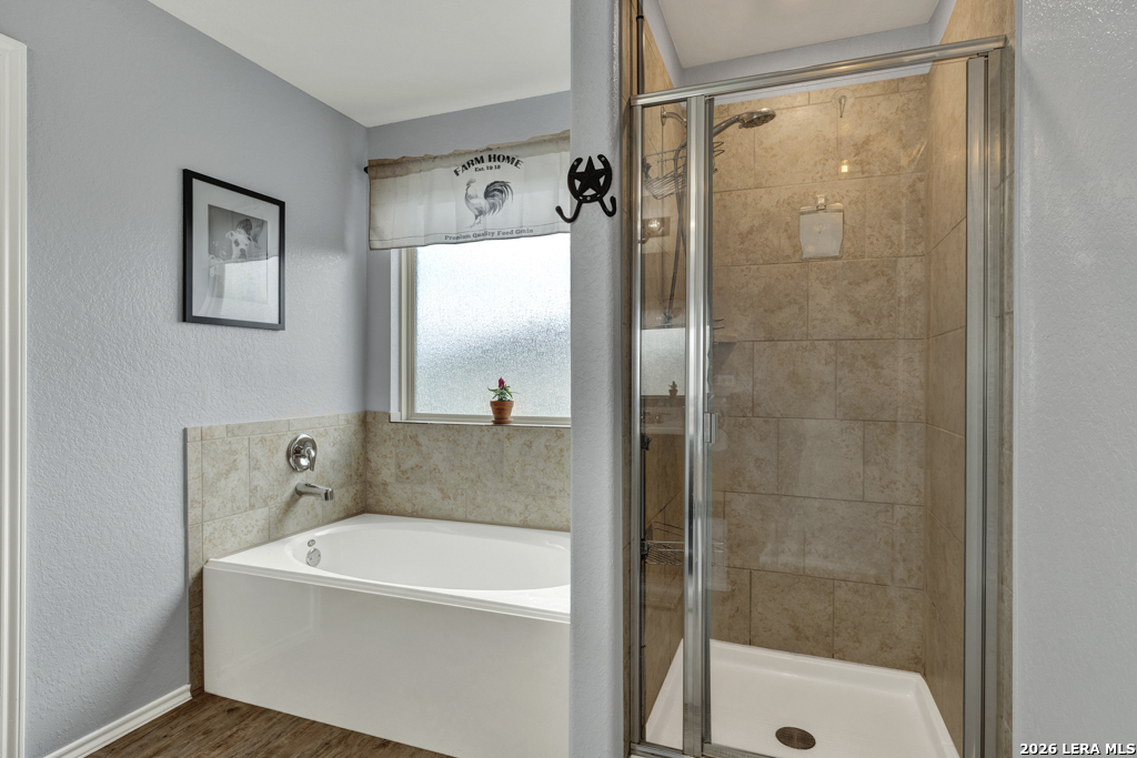 124 Field Ridge New Braunfels, TX 78130 - Photo 24 of 43 a bathroom with a bathtub and a shower