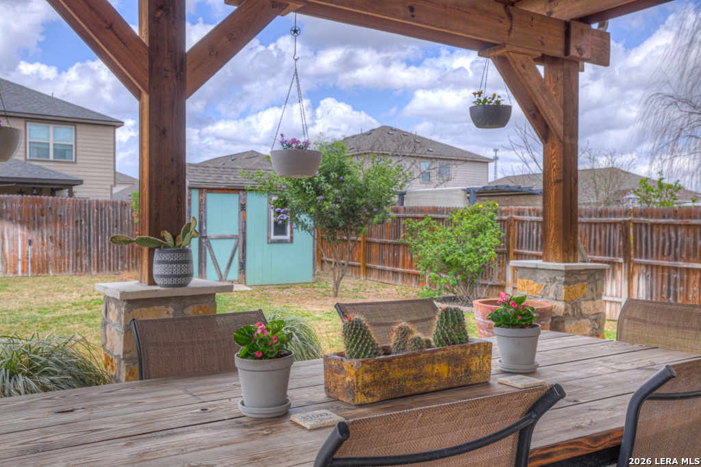 124 Field Ridge New Braunfels, TX 78130 - Photo 33 of 43 a view of a house with a chairs and table in a patio