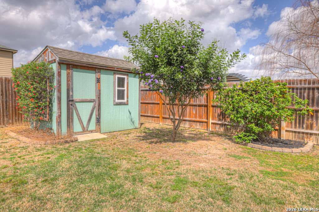 124 Field Ridge New Braunfels, TX 78130 - Photo 40 of 43 a view of a house with a yard and garage