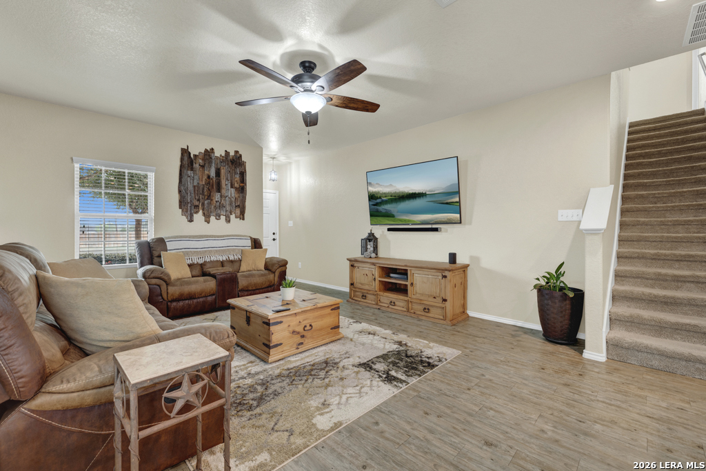 124 Field Ridge New Braunfels, TX 78130 - Photo 4 of 43 a living room with furniture a flat screen tv and a window