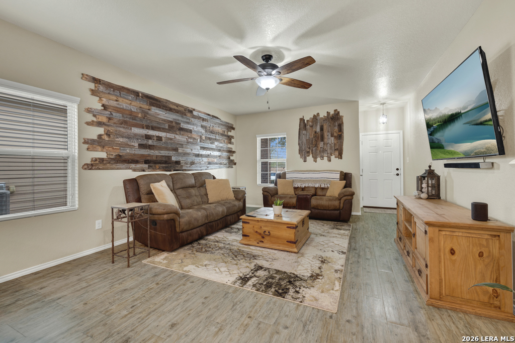 124 Field Ridge New Braunfels, TX 78130 - Photo 5 of 43 a living room with furniture and a flat screen tv