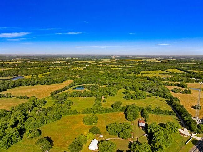 9015 Highway 69 Bells, TX 75414 - Photo 11 of 21 Aerial view of property and surrounding area featuring a large body of water
