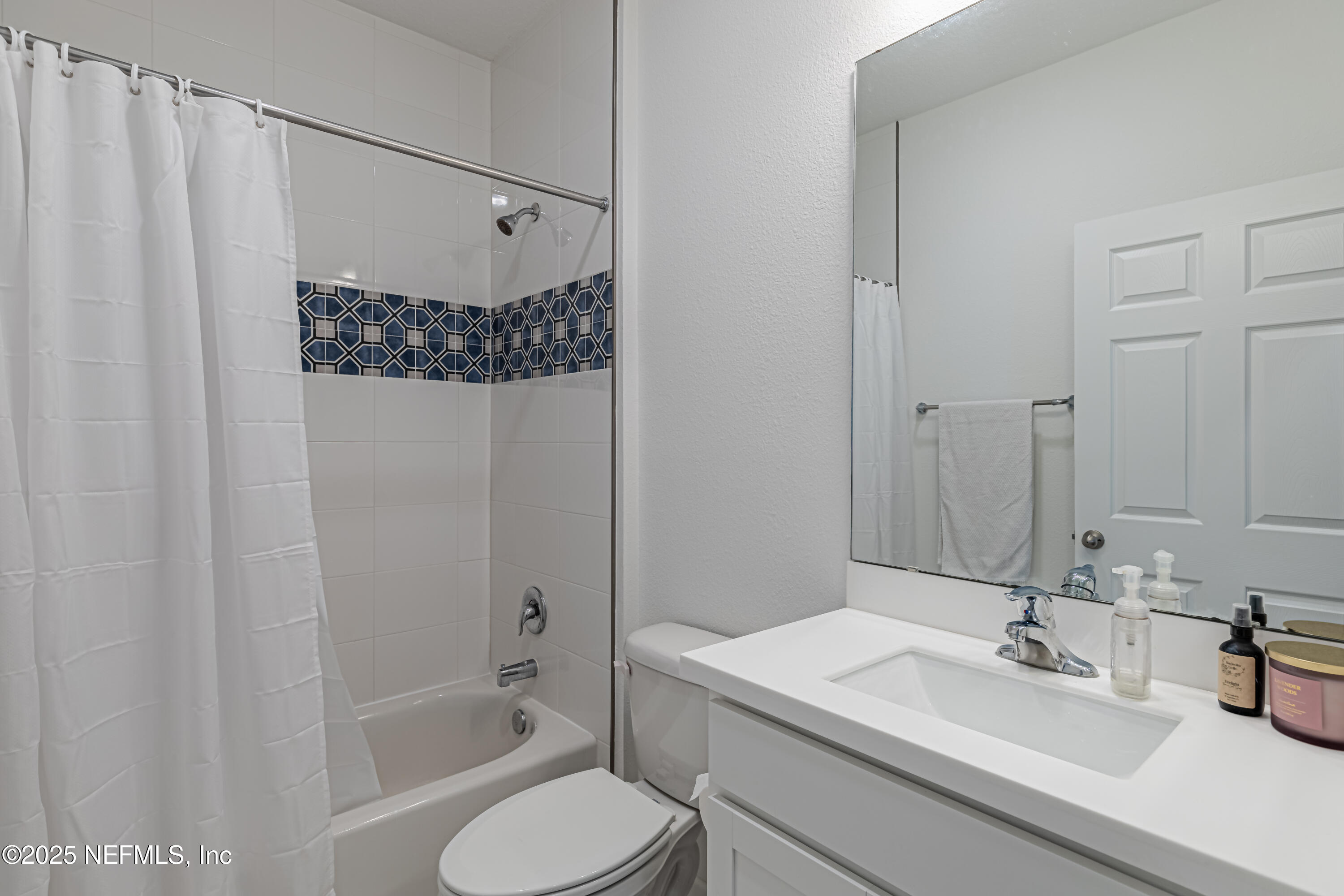383 Windswept Way Street St. Augustine, FL 32092 - Photo 30 of 34 a bathroom with a sink toilet and shower
