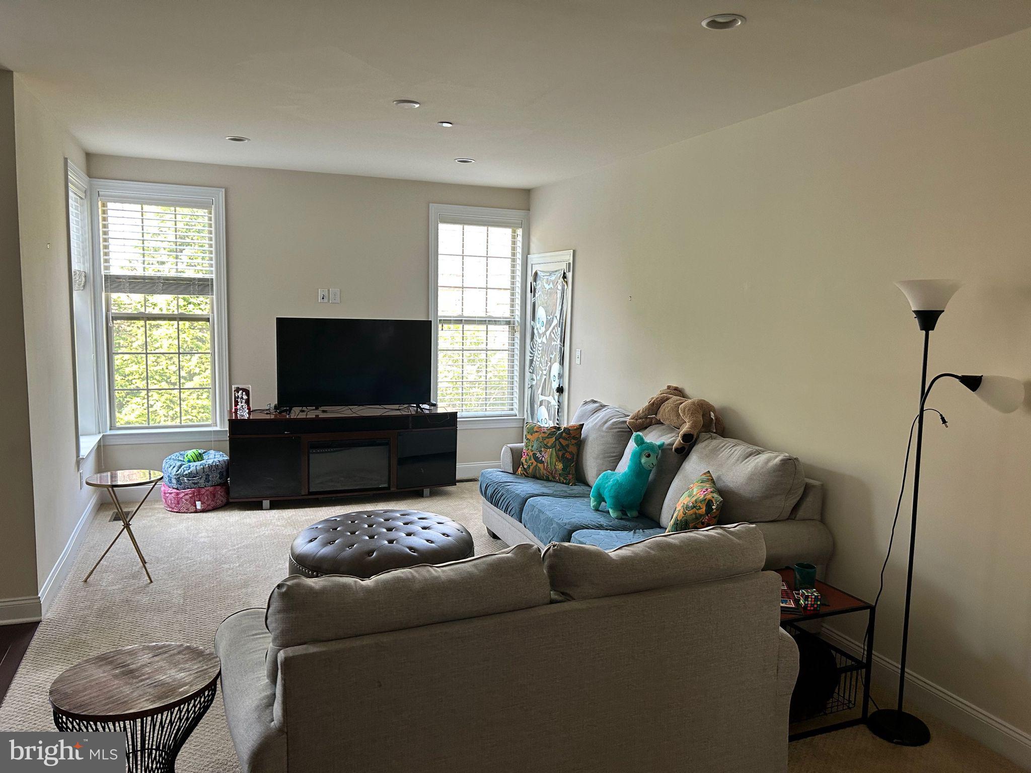 3049 Rainer Road Chester Springs, PA 19425 - Photo 17 of 19 a living room with furniture and a flat screen tv