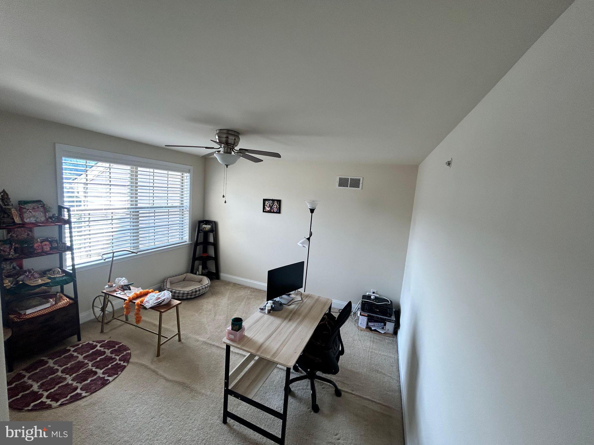 3049 Rainer Road Chester Springs, PA 19425 - Photo 10 of 19 a living room with furniture and a window