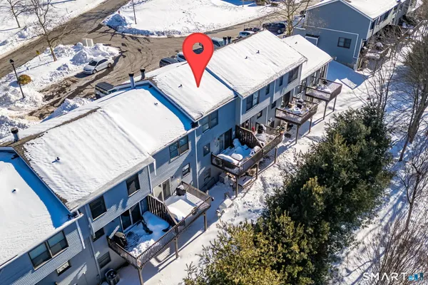 an aerial view of a house with a ocean view