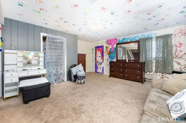 a living room with furniture and a couch