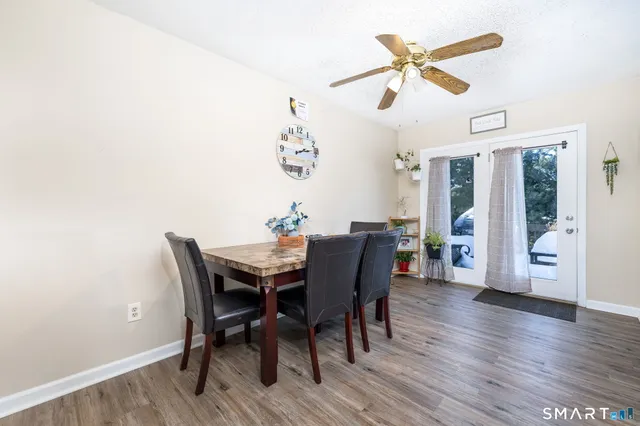 a kitchen with granite countertop a stove sink and cabinets