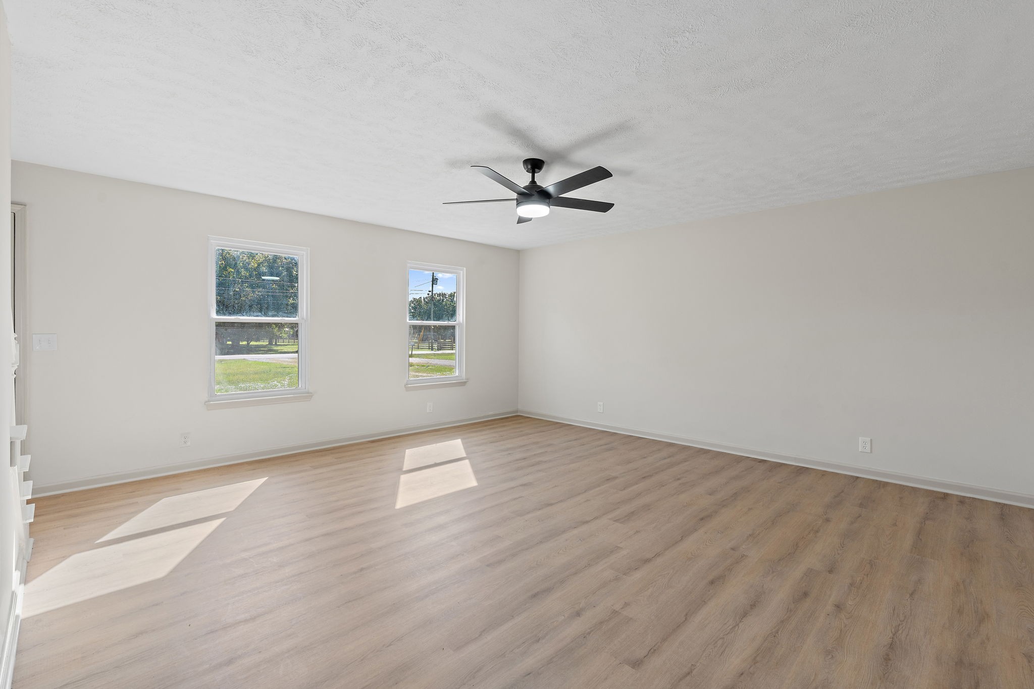 583 Parsons Road Christiana, TN 37037 - Photo 8 of 35 wooden floor in an empty room with a window