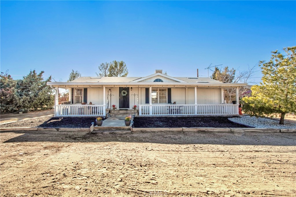 10967 Sunset Road Victorville, CA 92392 - Photo 1 of 1 a front view of a house with a yard