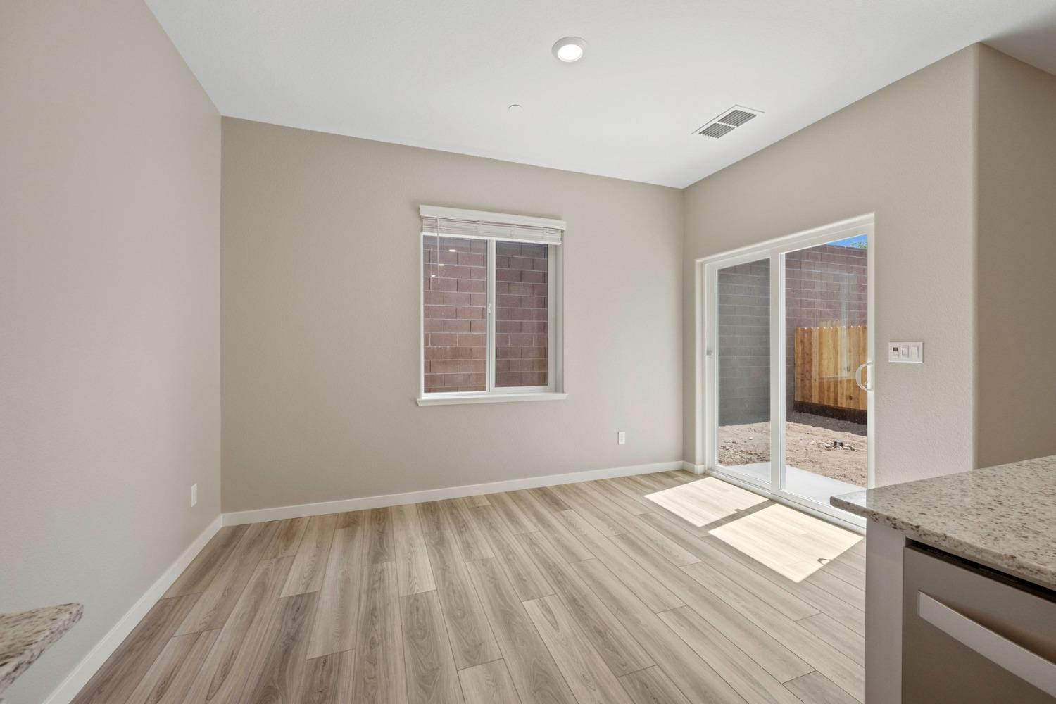 2948 Pulp Ml Lane Lincoln, CA 95648 - Photo 13 of 23 an empty room with wooden floor and windows