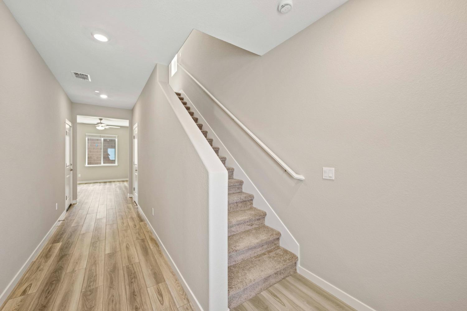 2948 Pulp Ml Lane Lincoln, CA 95648 - Photo 2 of 23 a view of a hallway with wooden floor and staircase