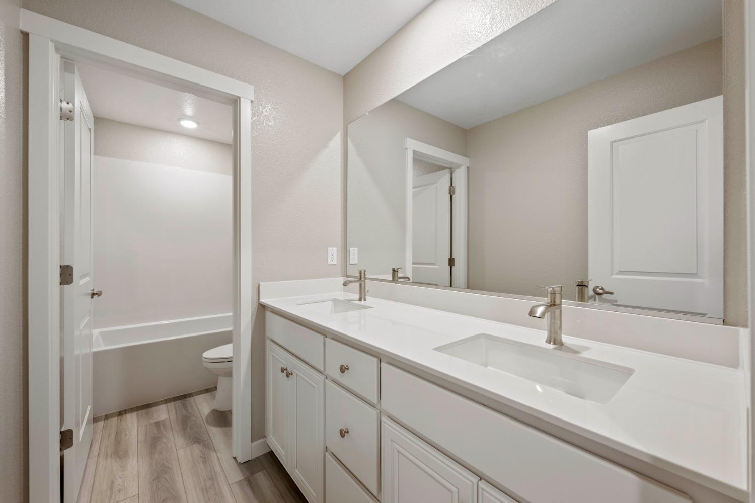 2948 Pulp Ml Lane Lincoln, CA 95648 - Photo 23 of 23 a bathroom with a sink double vanity granite tub and a mirror