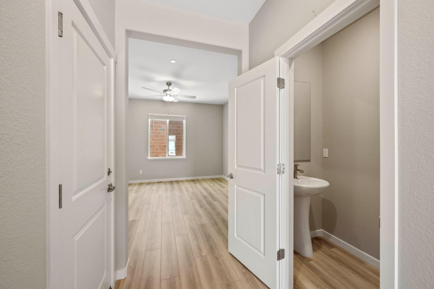 2948 Pulp Ml Lane Lincoln, CA 95648 - Photo 3 of 23 a view of an empty room with wooden floor and a window