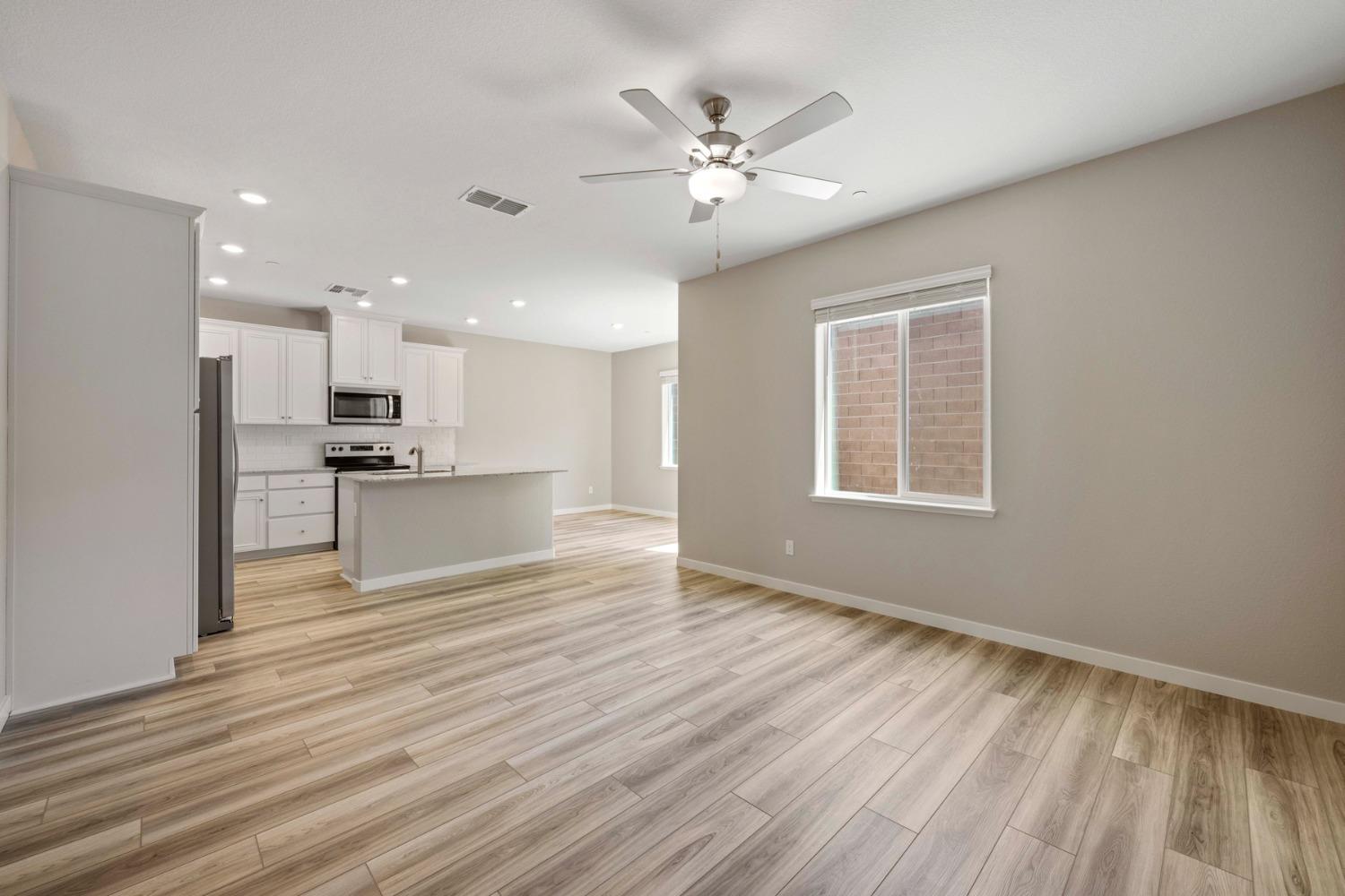 2948 Pulp Ml Lane Lincoln, CA 95648 - Photo 4 of 23 a view of an empty room with wooden floor and a window