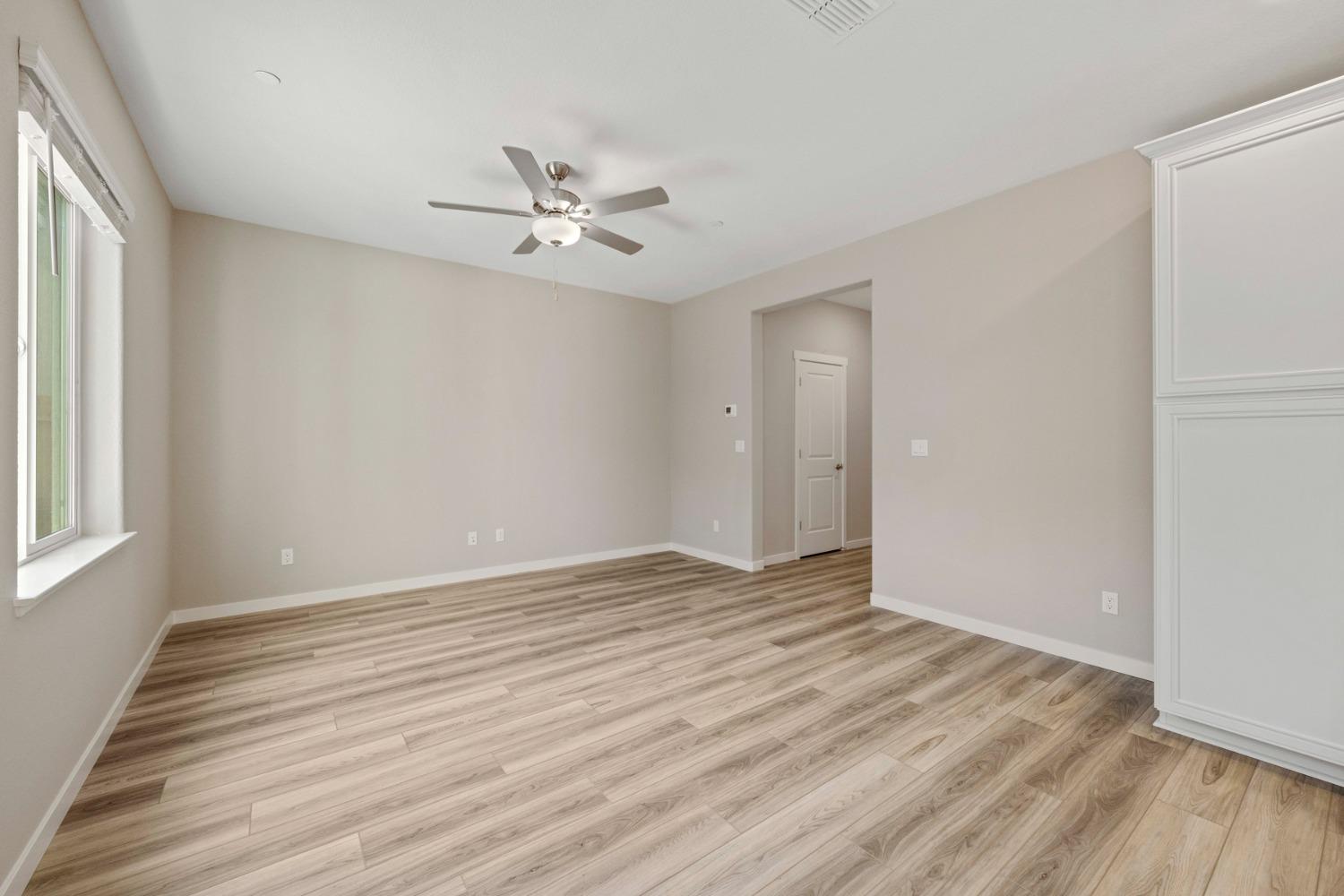 2948 Pulp Ml Lane Lincoln, CA 95648 - Photo 5 of 23 a view of empty room with wooden floor and fan