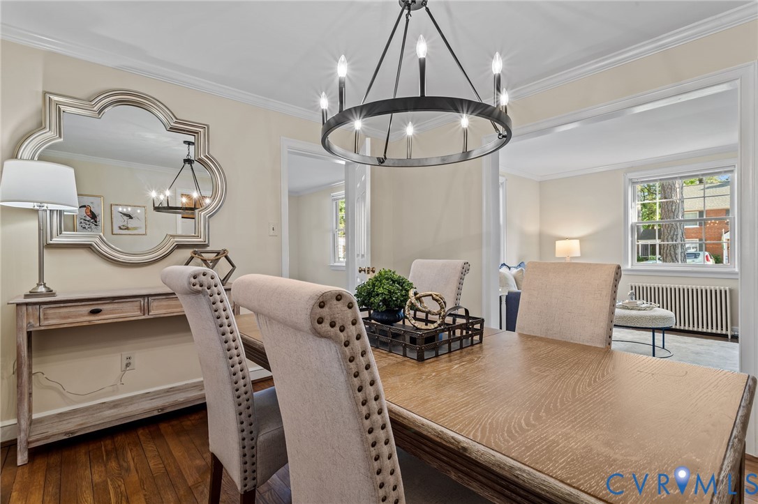 4804 Morrison Road Richmond, VA 23230 - Photo 11 of 48 a view of dining room and livingroom with furniture wooden floor chandelier