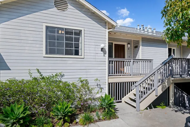 a view of a house with iron stairs