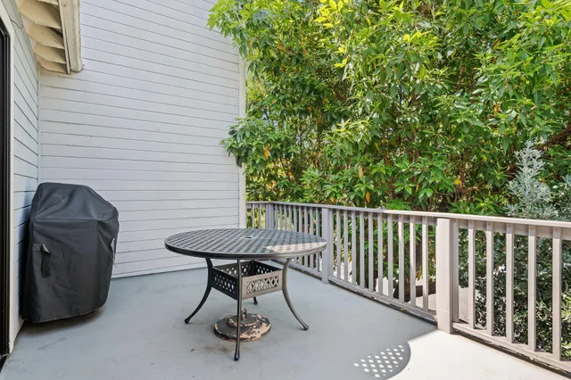 a view of a balcony with furniture