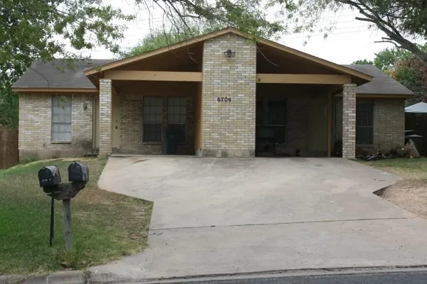 a front view of a house with glass windows