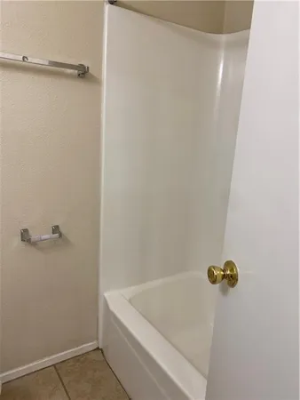 a bathroom with a bath tub