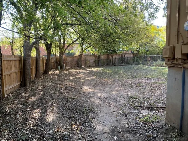 a backyard of a house with lots of green space