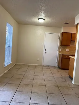 a view of a kitchen with a sink and a stove top oven