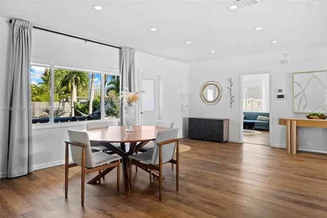 a kitchen with a table and chairs in it