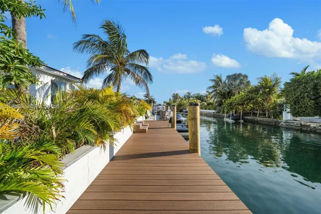 an aerial view of multiple houses with yard