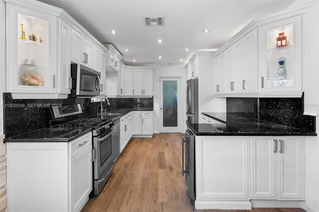 a bedroom with a bed and a flat screen television