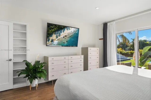 a bathroom with a tub shower vanity and a sink