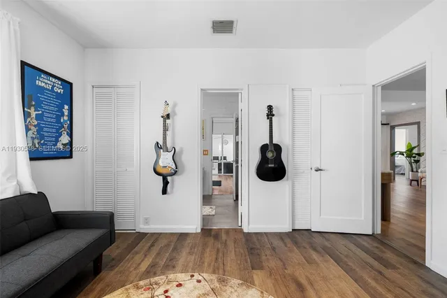 a view of a backyard with a patio and garden