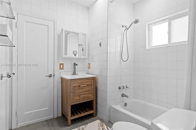 a living room with furniture and flat screen tv