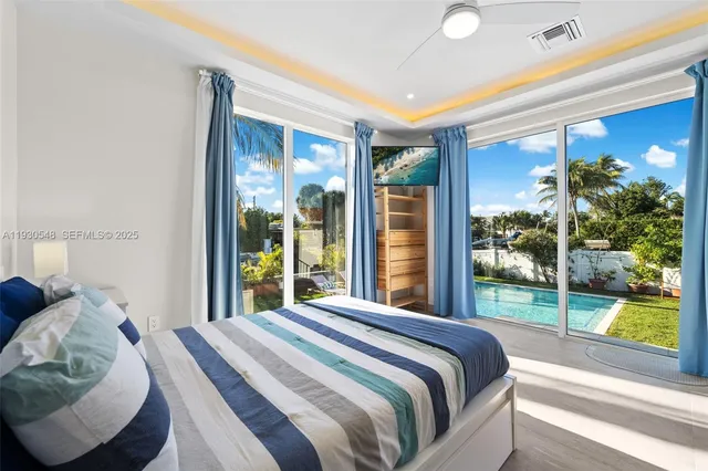 a view of a backyard with swimming pool