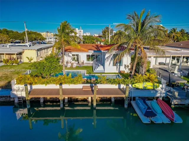 a view of a house with garden and patio