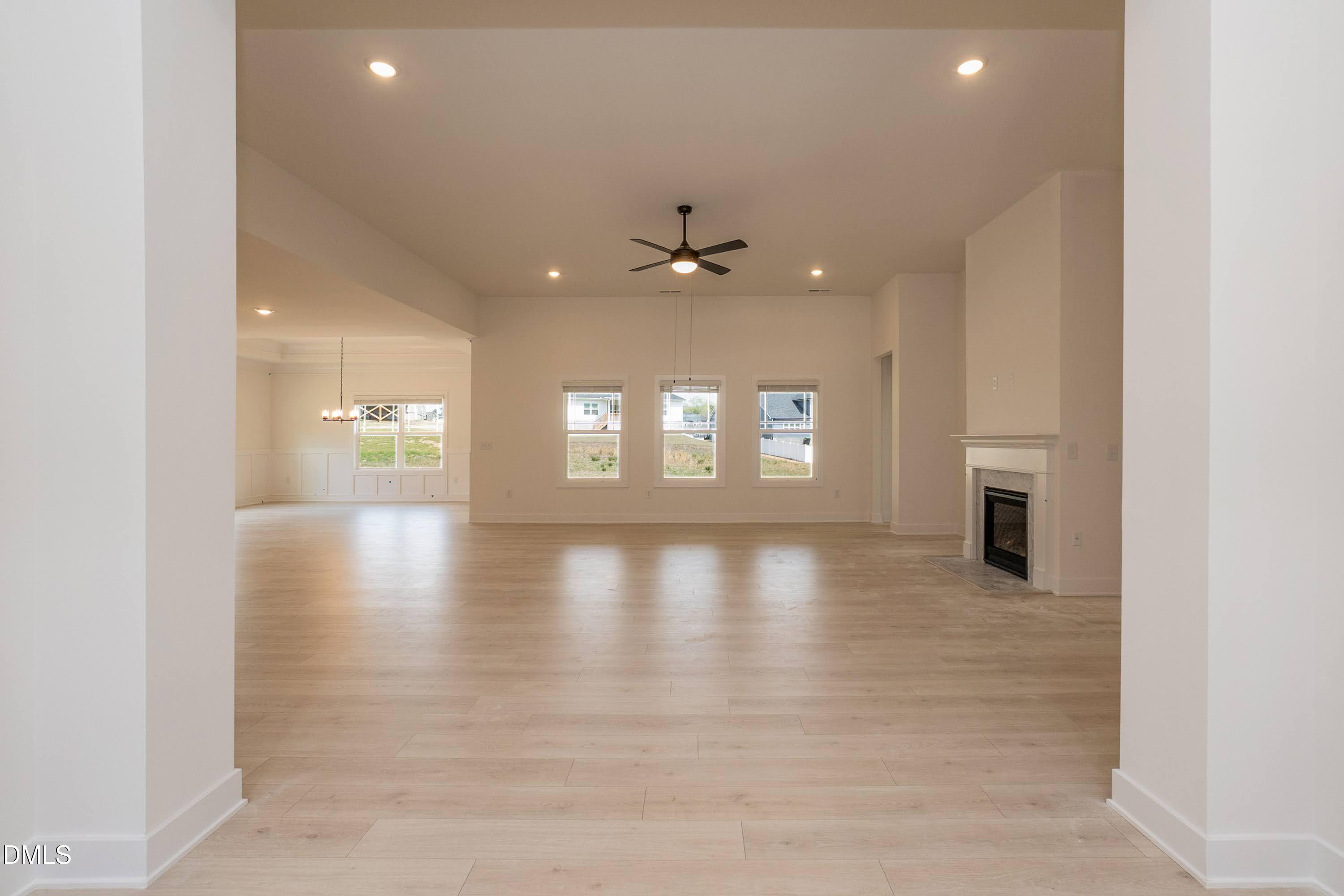 180 Galway Road Lillington, NC 27546 - Photo 10 of 41 wooden floor in an empty room with a window