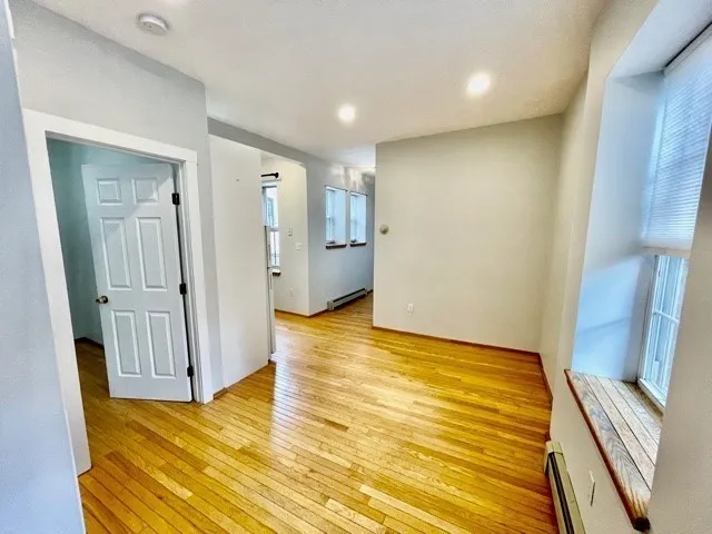 a view of an empty room with glass door